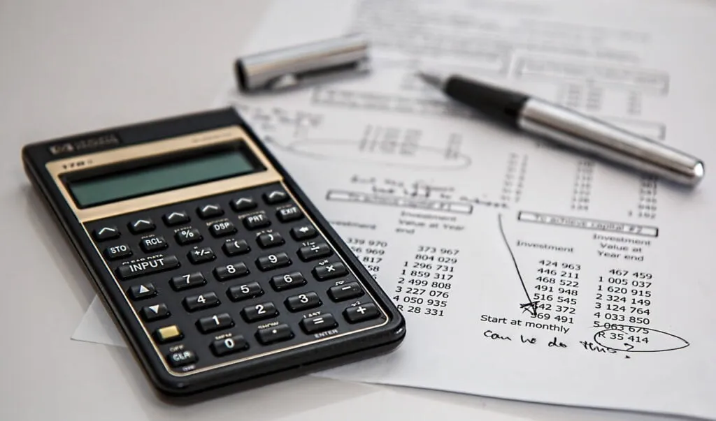 A calculator and some personal finance worksheets