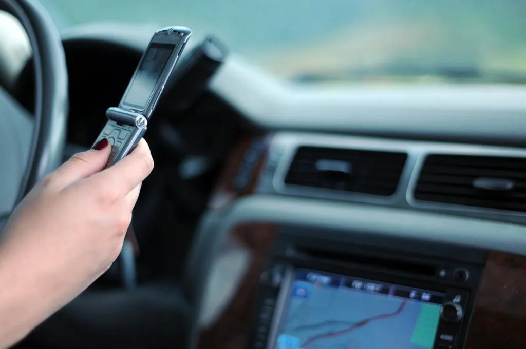 An idiot, being an idiot, texting and driving