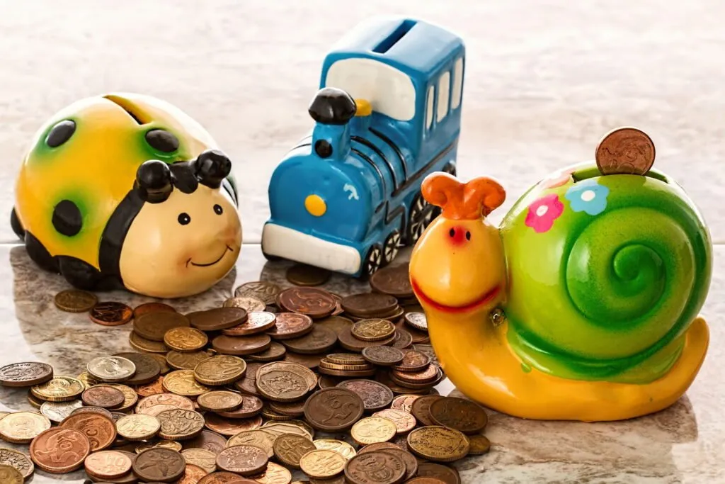 Piggy banks with spilled pennies